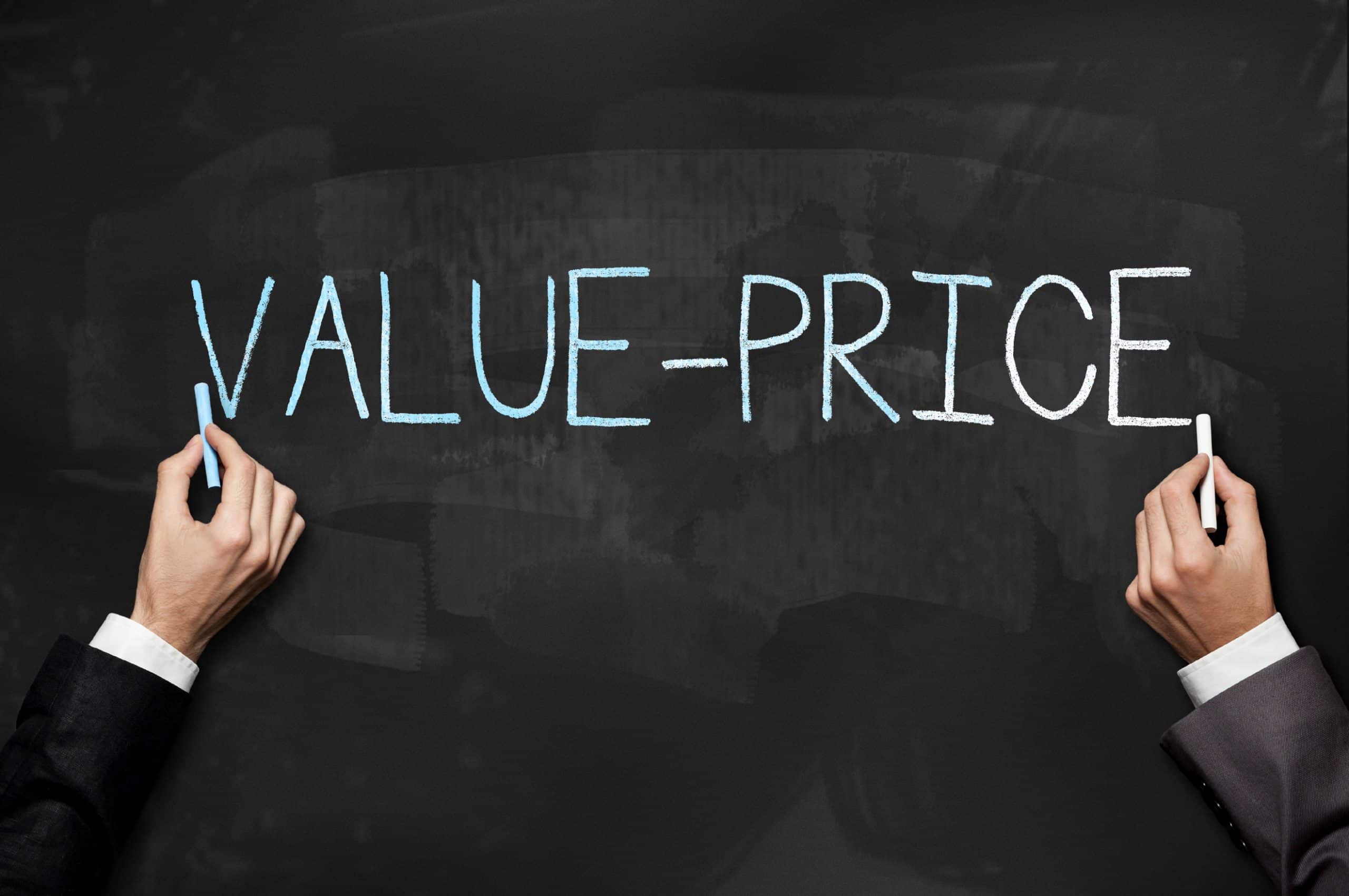 Business Valuation: 7 Reasons Why - Finding Good Value - a hand writing value - price on a blackboard