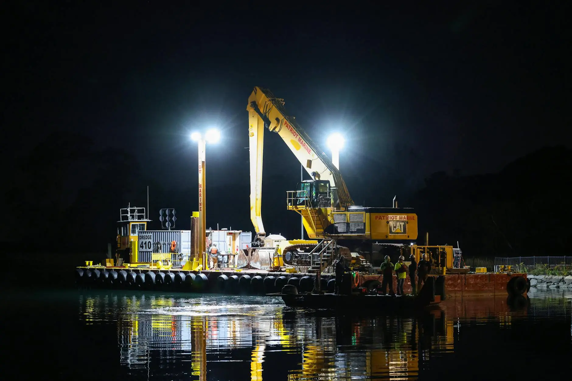 Equipment Valuation: The Importance of A Correct Value - industrial dredging operation at night